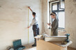 © JELENA JOJIC TOMIC/Stocksy - Couple renovate their apartment