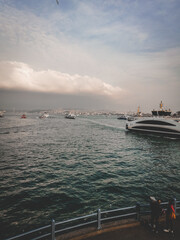 Canvas Print - Vertical shot of yachts and ships near Galata, Istanbul, Turkey