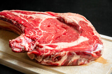 Wall Mural - Beef prime rib on a cutting board