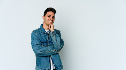 Young caucasian man isolated on white background smiling happy and confident, touching chin with hand.