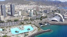 Far Sliding Shoot Of Tenerife - Santa Cruise City Showing Detailed City Relief From Birds Eye. Middle Of Video Pan Up For More Details In City. Includes Auditorium, Castle Of St John And Cargo Port.