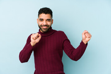 Wall Mural - Young mixed race arabic man isolated dancing and having fun.