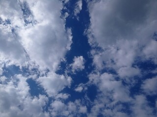 Wall Mural - white clouds in a dark blue sky