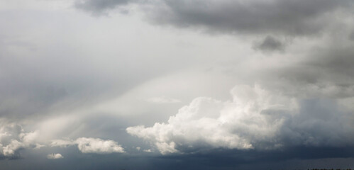 Wall Mural - bright and dark clouds looks like enigmatic figures in sky