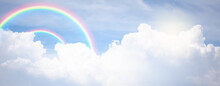 Rainbow In Cloudy Sky