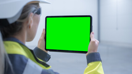 Poster - Industry 4.0 Modern Factory: Female Engineer Uses Digital Tablet Computer with Green Screen Mock-up Template Suitable for Visualizing Augmented Reality Software of Mapping Manufacturing Plant Room.