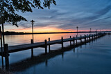 Fototapeta Pomosty - sunset on the pier with dramatic sky