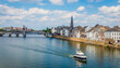 Maastricht river view with boat on river meuse