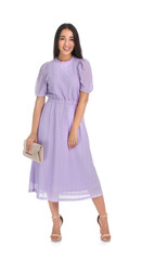 Poster - Young woman wearing stylish lilac dress with elegant clutch on white background