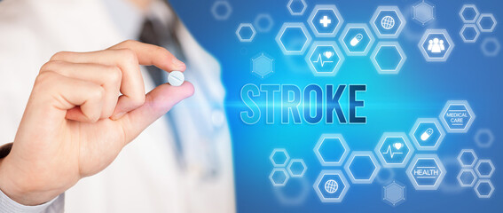 Close-up of a doctor giving you a pill with STROKE inscription, medical concept