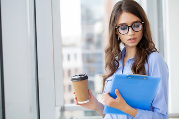 Wall Mural - Portrait of beautiful young woman working in the office.