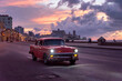 © Bisual Studio/Stocksy - Classic car driving in La Havana, Cuba