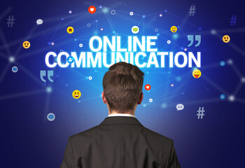 rear view of a businessman with online communication inscription, social networking concept