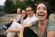 © Rob and Julia Campbell/Stocksy - Happy, healthy friends hanging out together outside.