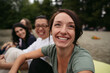 © Rob and Julia Campbell/Stocksy - Happy, healthy friends hanging out together outside.