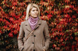 © Djekic/Stocksy - Girl In Front Of Wall Covered By Leaves