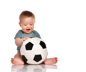 Little kid boy holding a soccer ball and going to sneeze on a white background.