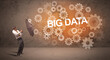 © ra2 studio - Businessman defending with umbrella from BIG DATA inscription, technology concept