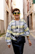© Thais Varela/Stocksy - very stylish mature woman on the street.