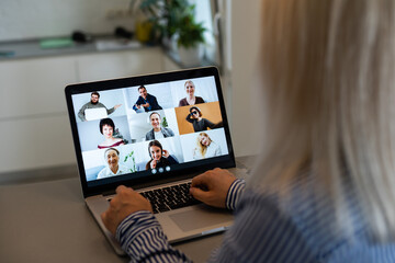 Beautiful young woman having video conference call via computer. Call Meeting. Home office. Stay at home and work from home concept during Coronavirus pandemic