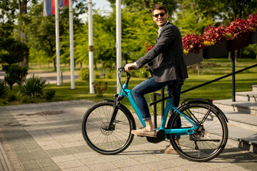 Young businessman on the ebike