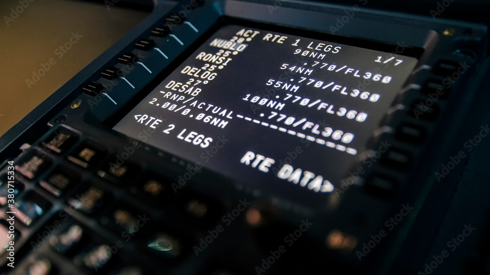 Barcelona, Spain - April 12, 2019 Close up of a flight management computer input and display. Modern jet airliner avionics in detail - obrazy, fototapety, plakaty 