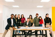 © MyMicrostock/Stocksy - Diverse happy coworkers with executive in office