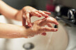 © sally anscombe/Stocksy - Child washing their hands