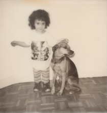 Polaroid Photo Of A Kid With A Dog