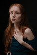 © Ksenia Krondo/Stocksy - The redhead girl looking at the camera crying