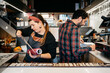 © Sergio Marcos/Stocksy - Man and woman working in cafe