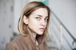 © vradiy.ru/Stocksy - Portrait of young woman in coat