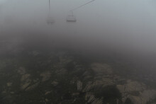 Aerial View Of A Mountain Landscape In Fog And Cable Car