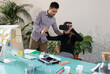 © Garage Island Crew/Stocksy - Business man and woman working at office with VR headset