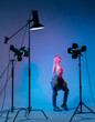 © Julie Meme/Stocksy - The girl with pink hair in a color light at the studio with light equipments