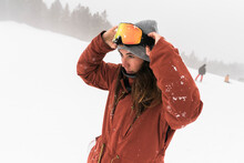 Woman Having Fun During A Day On The Snowboard