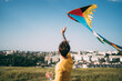 © vradiy.ru/Stocksy - Man with flying colorful kite