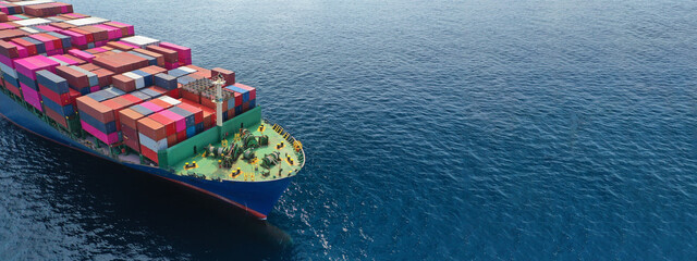 Aerial drone panoramic ultra wide photo of industrial container tanker ship loaded with colourful truck size containers cruising open ocean deep blue sea