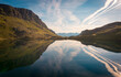 © Javier Martinez/ADDICTIVE STOCK - Breathtaking scenery of mountain ridge and calm lake in summer