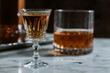 © Dani Serrano/ADDICTIVE STOCK - Side view of whiskey in glass and bottle arranged on marble table in bar