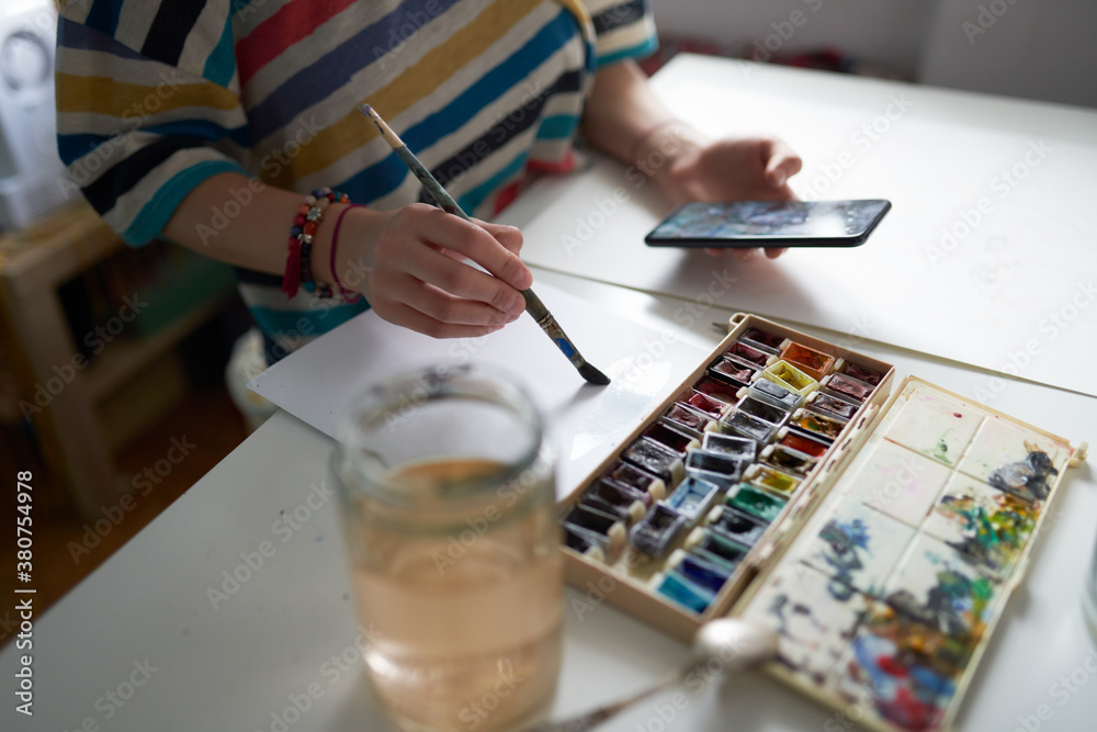 Crop Anonymous Female Artist Painting With Watercolors And Watching