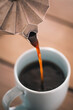 © 365mm/Stocksy - Pouring coffee in a cup