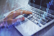 © peshkova - Double exposure of woman hands typing on computer and forex chart hologram drawing. Stock market analysis concept.