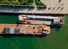 Cargo Transportation By Construction Materials Transportet Building Pipes And Metal Structures On Barges