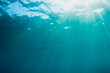 © Jovana Milanko/Stocksy - Ocean surface with sunlight underwater