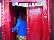 A Woman Opens The Red Door And Walks In, Lamayuru Gompa, Lamayuru (Lamayouro), Leh, Ladakh, Jammu And Kashmir, India