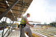 © Hugh Sitton/Stocksy - Construction site (carpenters working on house build).