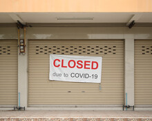 Shophouse Sign With Wording " Closed Due To Covid 19 " Hanging On The Door