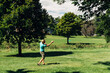 © Gabriel (Gabi) Bucataru/Stocksy - Man throwing a disk at a disc golf outing