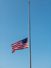American Flag Flying At Half Mast As Symbol Of Nation  Mourning